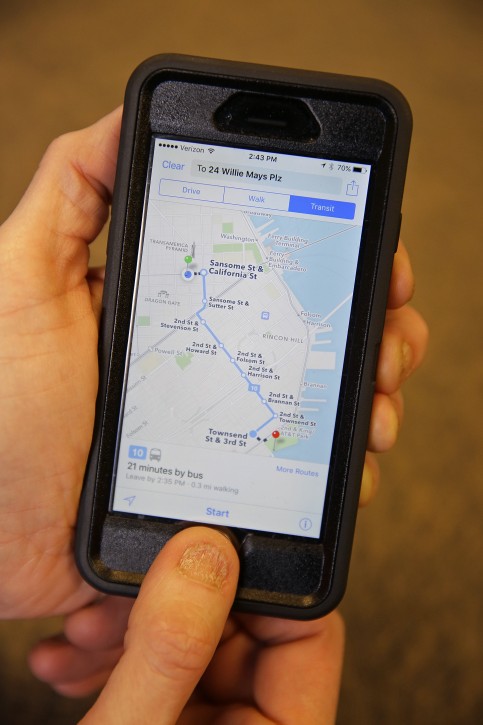 In this photo taken Friday, Dec. 4, 2015, the Apple Maps app displays transit directions in San Francisco. Apple, Google and several smaller companies all help you get from point A to B via public transit. (AP Photo/Eric Risberg)