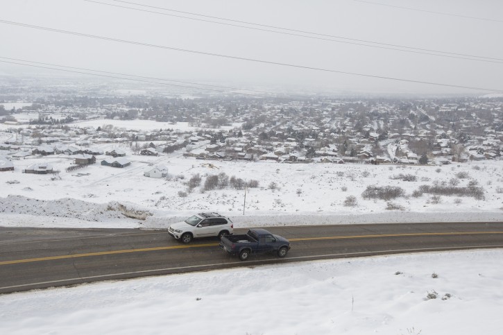 Vehicles travel on North Ogden Canyon Road in the North Ogden Divide, Utah, Tuesday, Dec. 29, 2015. Sarah Crenshaw was edging along the familiar mountain road in Utah when her SUV hit a patch of black ice and slid over a precipice. Crenshaw, 48, survived the 320-foot tumble into a ravine on the morning of Dec. 20, escaping with only minor injuries. (Briana Scroggins/Standard-Examiner via AP)