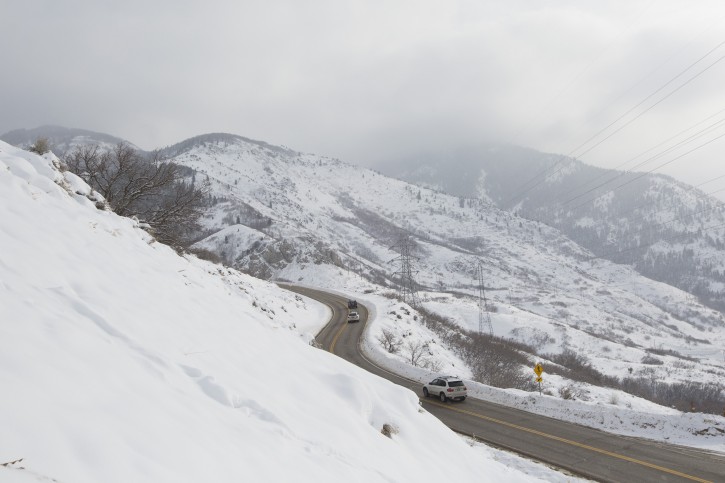 Vehicles travel on North Ogden Canyon Road in the North Ogden Divide, Utah, Tuesday, Dec. 29, 2015. Sarah Crenshaw was edging along the familiar mountain road in Utah when her SUV hit a patch of black ice and slid over a precipice. Crenshaw, 48, survived the 320-foot tumble into a ravine on the morning of Dec. 20, escaping with only minor injuries. (Briana Scroggins/Standard-Examiner via AP) 