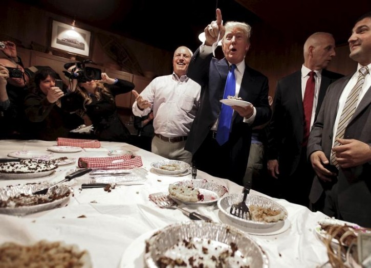 FILE - Potential Republican 2016 presidential candidate Donald Trump eats a piece of pie after speaking at the Snow Shoe Club in Concord, New Hampshire, United States April 27, 2015. REUTERS/Lisa Hornak 