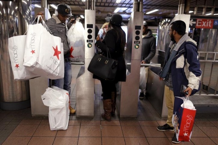 FILE - Shoppers enter the Herald Square Subway station after early morning Black Friday Shopping in New York November 27, 2015. REUTERS/Brendan 