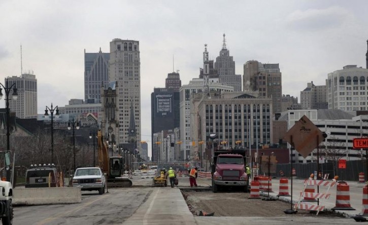 Work crews work on constructing the new M-1 Rail streetcar project along Woodward Avenue in Detroit, Michigan December 2, 2015.  REUTERS