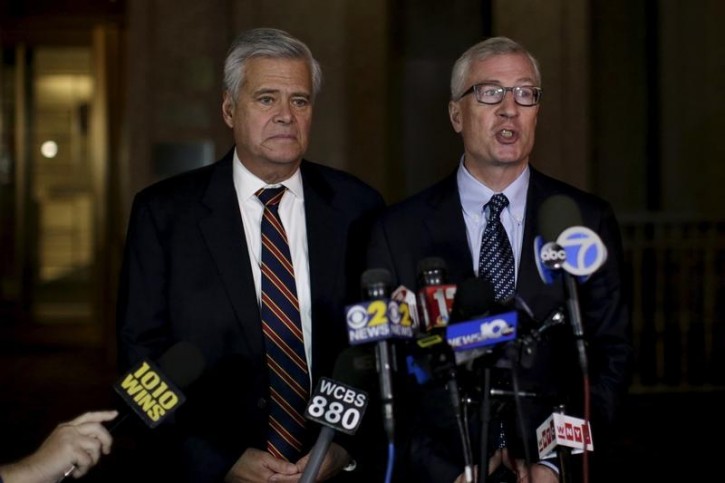 Lawyer Robert Gage (R) speaks to the media with his client former New York state Senate Majority Leader Dean Skelos as they exit the Manhattan federal court house in New York December 10, 2015.   REUTERS/Brendan McDermid