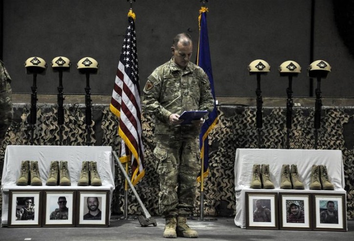 Service members from several units at Bagram Air Field, Afghanistan, pay their respects during a fallen comrade ceremony held in honor of six Airmen in this December 23, 2015 handout photo. The six Airmen lost their lives in an improvised explosive attack near Bagram, Afghanistan December 21, 2015. REUTERS/Tech. Sgt. Robert Cloys/455th Air Expeditionary Wing/USAF/Handout via Reuters 