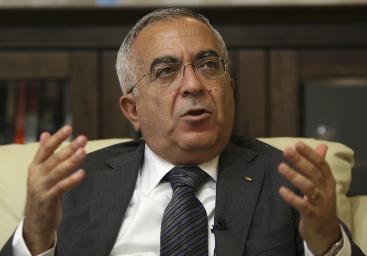 FILE - In this June 28, 2011 file photo, Salam Fayyad, economist and former Palestinian prime minister, speaks during an interview with The Associated Press in the West Bank city of Ramallah.  (AP Photo/Majdi Mohammed, File)