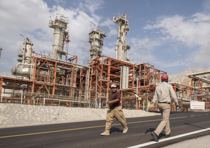 FILE - Iranian workers walk at a unit of South Pars Gas field in Asalouyeh Seaport, north of Persian Gulf, Iran November 19, 2015. REUTERS/Raheb Homavandi/TIMA 