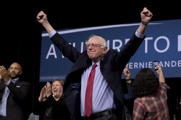 Democratic presidential candidate Sen. Bernie Sanders, I-Vt., center, acknowledges the cheering crowd after a rally Friday, Feb. 19, 2016, in Henderson, Nev.  The Democratic presidential candidate has preferred rabble-rousing to the schmoozing required to get bills passed. So its not surprising that his 25-year congressional career is defined by what hes opposed _ big banks, the Iraq War, the Patriot Act, tax cuts for the wealthy _ rather than what hes accomplished.   (AP Photo/Jae C. Hong)