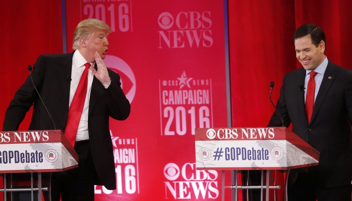 Republican presidential candidate, businessman Donald Trump  speaks to Republican presidential candidate, Sen. Marco Rubio, R-Fla.,  during the CBS News Republican presidential debate at the Peace Center, Saturday, Feb. 13, 2016, in Greenville, S.C. (AP Photo/John Bazemore)