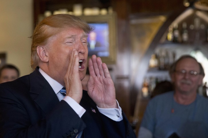 Republican presidential candidate Donald Trump gestures as he speaks during a lunch stop, Thursday, Feb. 18, 2016, in North Charleston, S.C. (AP Photo/Matt Rourke)