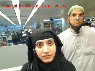 FILE - Tashfeen Malik, (L), and Syed Farook are pictured passing through Chicago's O'Hare International Airport in this July 27, 2014 handout photo obtained by Reuters December 8, 2015.