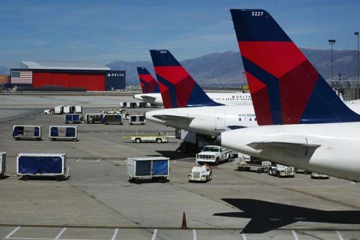 FILE - Delta planes line up at their gates while on the tarmac of Salt Lake City International Airport in Utah September 28, 2013 REUTERS