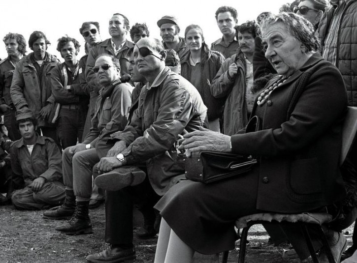 FILE - Prime Minister Golda Meir (R) accompanied by her Defense Minister Moshe Dayan, meets with Israeli soldiers at a base on the Golan Heights after intense fighting during the 1973 Yom Kippur War. REUTERS