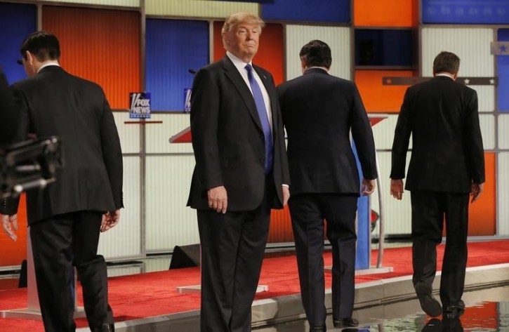 FILE  -Republican U.S. presidential candidate Donald Trump remains standing at the front of the stage as rivals Marco Rubio (L), Ted Cruz (2nd R) and John Kasich (R) head to their podiums at the start of the U.S. Republican presidential candidates debate in Detroit, Michigan, March 3, 2016. REUTERS/Jim Young 