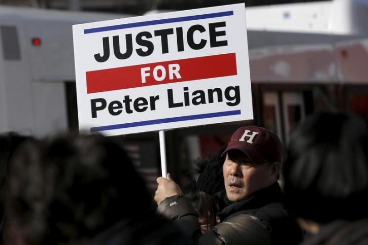 FILE - Protesters hold a rally in support of former NYPD officer Peter Liang in the Brooklyn borough of New York February 20, 2016. Reuters