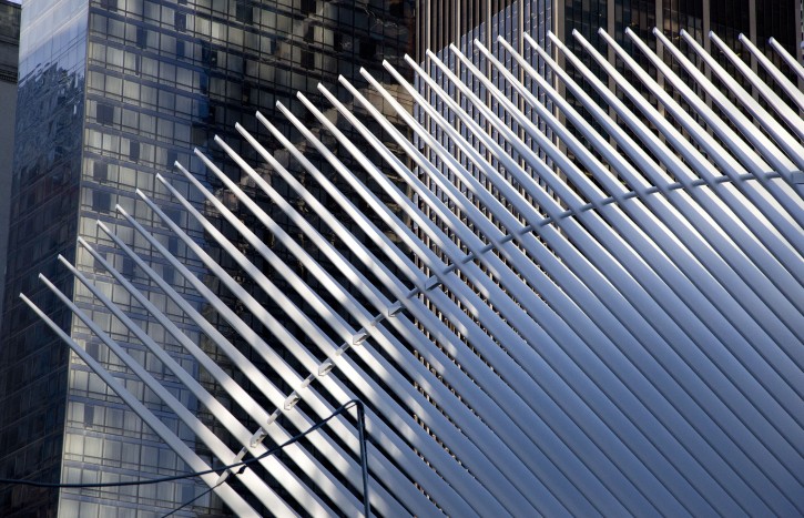 Sunlight hits the "ribs" of the World Trade Center Transportation Hub, Thursday, March 3, 2016, in New York. Officials say the transit hub's cathedral-like pavilion will partially open to the public Thursday afternoon. Cost overruns have been blamed on the architect's demands and the logistical complexity of building it while the Sept. 11 memorial and office towers were also under construction. The transportation hub will connect Port Authority Trans-Hudson trains to New Jersey with 11 New York City subway lines and ferry service. (AP Photo/Mark Lennihan)