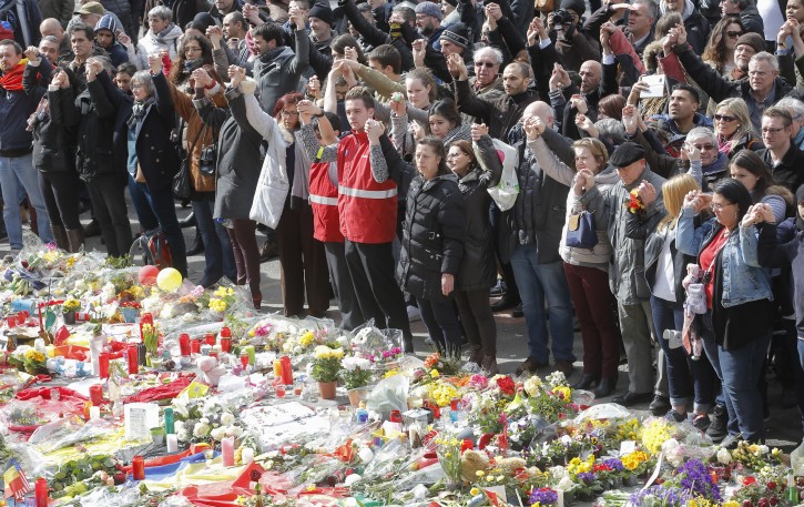 People gather to commemorate the victims of the 22 March terror attacks, at the site of a memorial in Place de la Bourse, Brussels, Belgium, 27 March 2016.  EPA