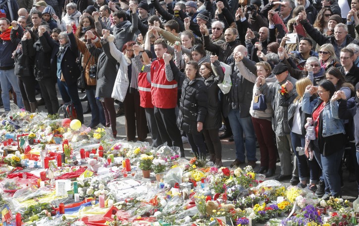 People gather to commemorate the victims of the 22 March terror attacks, at the site of a memorial in Place de la Bourse, Brussels, Belgium, 27 March 2016. EPA