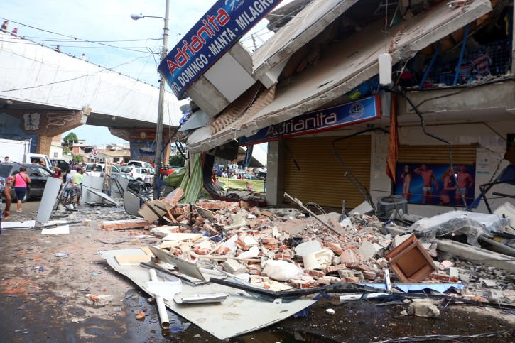 Rubble from a collapsed building lays on the ground in Tarqui, the business district of Manta, Ecuador, Sunday, April 17, 2016. A powerful, 7.8-magnitude earthquake shook Ecuador's central coast on Saturday, killing hundreds. (AP Photo/Patricio Ramos)