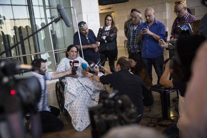 Rachel Dadon speaks with the press at Hadassa Ein Karem hospital where she and her daughter are hospitalized after being injured from the bus bombing that took place in Jerusalem, on April 19, 2016. Flash90
