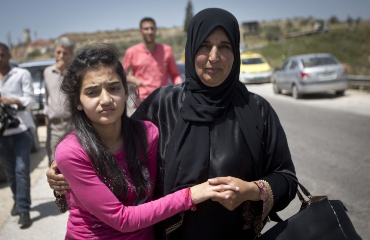 Palestinian girl Dima Wawi, 12, greeted by her mother Sabha Wawi after her release from the israeli jails, at Jabara checkpoint near the West Bank town of Tulkarem, on April. 24, 2016. Photo by Haytham Shtayeh/FLASH90