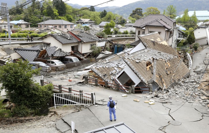 Resident houses are seen destroyed after an earthquake in Mashiki, Kumamoto prefecture, southern Japan, Saturday, April 16, 2016. Powerful earthquakes a day apart shook southern Japan, trapping many beneath flattened homes and sending thousands to seek shelter in gymnasiums and hotel lobbies. (Yusuke Ogata/Kyodo News via AP) 