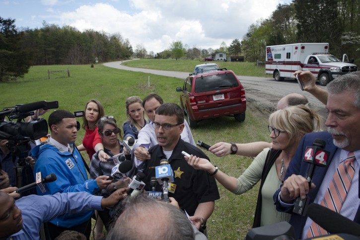 Lt. Michael Preston, of the Ross County Sheriff's Department speaks to the media on Union Hill Road that approaches a crime scene, Friday, April 22, 2016, in Pike County, Ohio. AP