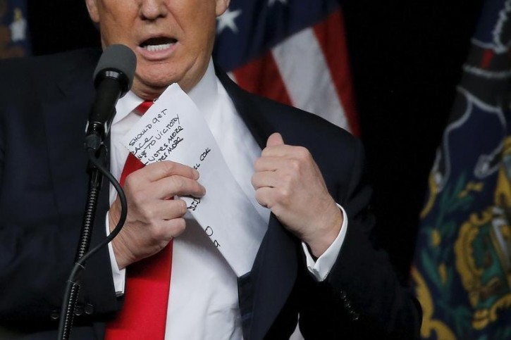 Republican U.S. presidential candidate Donald Trump holds a paper with notes during a campaign event in Harrisburg, Pennsylvania, U.S., April 21, 2016. REUTERS/Carlos Barria