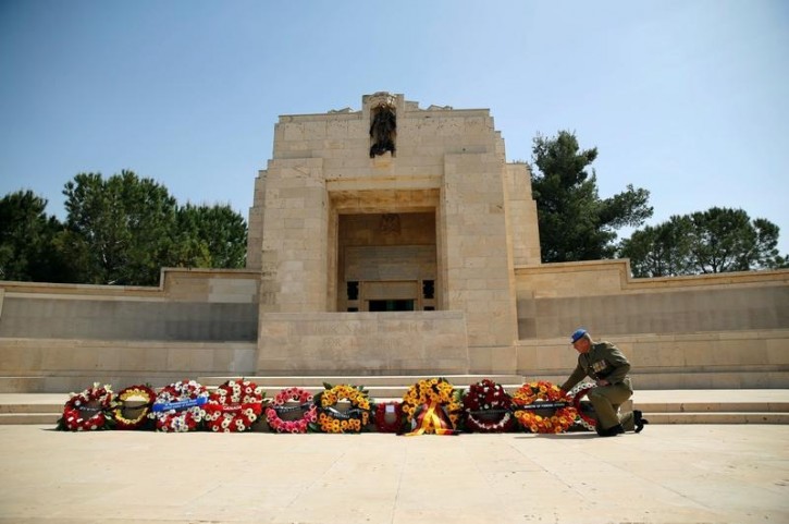 A military officer lays a wreath at the annual ANZAC Day memorial ceremony at the Commonwealth War Graves Cemetery in Jerusalem April 25, 2016. REUTERS/Ammar Awad