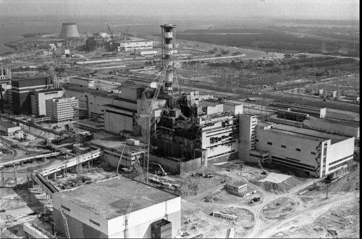 FILE - A 1986 file photo of an aerial view of the Chernobyl nuclear plant in Chernobyl, Ukraine showing damage from an explosion and fire in reactor four on April 26, 1986 that sent large amounts of radioactive material into the atmosphere. Telling the story of Chernobyl in numbers 30 years later involves dauntingly large figures and others that are even more vexing because they're still unknown. (AP Photo/Volodymyr Repik, File)