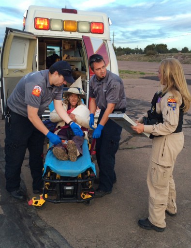 This photo taken, Saturday, April 9, 2016, and provided by Arizona Department of Public Safety shows an ambulance taking Ann Rodgers, 72 , to safety after she was lost in the forest for nine days. Rodgers got lost in the White Mountains in eastern Arizona after her hybrid car ran out of gas and battery on March 31. Rodgers survived in the forest for nine days by drinking pond water and eating plants. Authorities came across her dog April 9, and a DPS flight crew spotted a âhelpâ signal made of sticks and rocks on the ground. Rodgers had left the area, but she was found on a reservation that's home to the White Mountain Apache Tribe after starting a signal fire. (Arizona Department of Public Safety via AP)