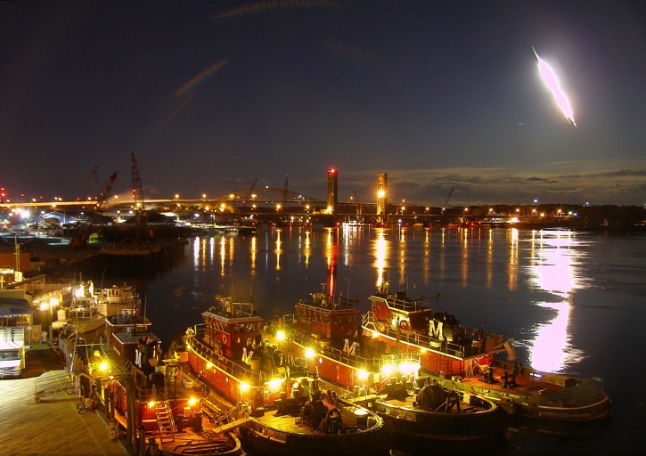 A meteor that was seen in several states is captured by a webcam streaking across the night sky over Portsmouth Harbor early on Tuesday, May 17, 2016, in Portsmouth, N.H. The bright flash was apparently left by a meteor burning up as it passed through the earth's atmosphere. The American Meteor Society reported sightings across the Northeast and in parts of Canada. (Mike McCormack portsmouthwebcam.com via AP)