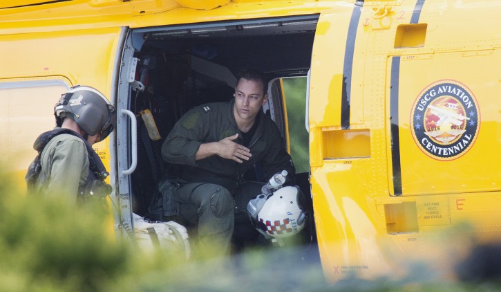 A Navy aviator involved in a crash waits to exit a coast guard helicopter at Sentara Norfolk General Hospital in Norfolk, Va., Thursday, May 26, 2016. Two Navy jet fighters collided off the coast of North Carolina during a routine training mission on Thursday, sending several people to the hospital, officials said. (L. Todd Spencer/The Virginian-Pilot via AP)  