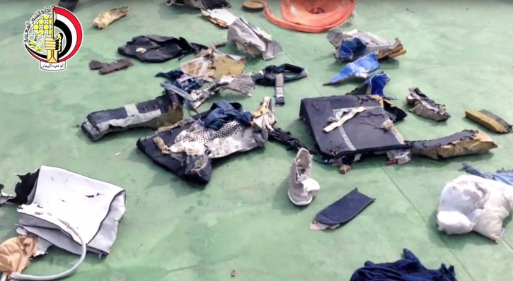 FILE - This file still image taken from video posted Saturday, May 21, 2016, on the official Facebook page of the Egyptian Armed Forces spokesman shows some personal belongings and other wreckage from EgyptAir flight 804 in Egypt. Human remains retrieved from the crash site of EgyptAir Flight 804 suggest there was an explosion on board that may have brought down the aircraft in the east Mediterranean, a senior Egyptian forensics official said on Tuesday, May 24, 2016. (Egyptian Armed Forces via AP, File)