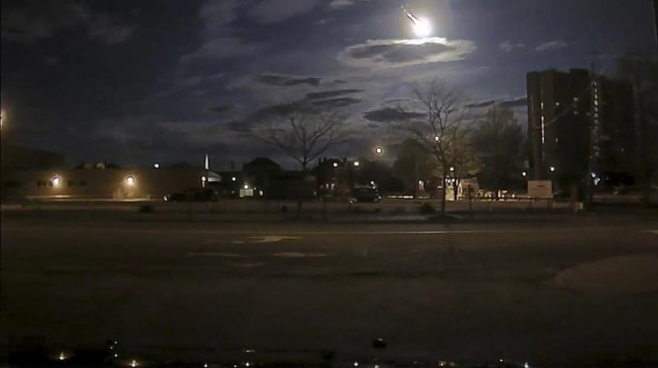A meteor streaking across the sky was caught on Portland Maine Police Department patrol vehicle camera in this images posted on social media in Portland, Maine, United States early May 17, 2016. Courtesy Portland Maine Police Department/Handout via REUTERS 