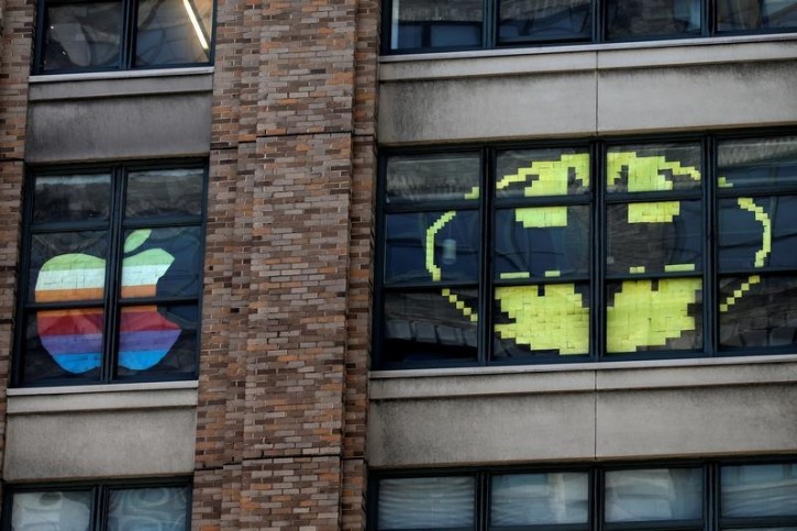 Images created with Post-it notes are seen in the windows of offices at 75 Varick Street in lower Manhattan, New York, U.S., May 18, 2016, where advertising agencies and other companies have started what is being called a "Post-it note art war" with employees creating colorful images in their windows with Post-it notes. REUTERS/Mike Segar 