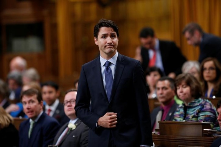 FILE - Canada's Prime Minister Justin Trudeau pauses while responding to questions after delivering an apology in the House of Commons on Parliament Hill in Ottawa, Ontario, Canada, May 19, 2016 following a physical altercation the previous day. REUTERS/Chris Wattie