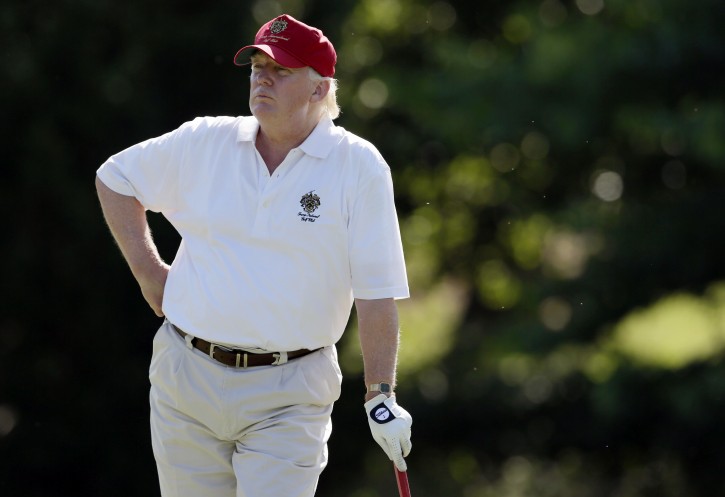 FILE - In this June 27, 2012, file photo, Donald Trump stands on the 14th fairway during a pro-am round of the AT&T National golf tournament at Congressional Country Club in Bethesda, Md. Donald Trump wants to make one thing perfectly clear  he doesn't cheat in golf. Trump also says he has never played golf with former boxer Oscar De La Hoya, who earlier this week questioned Trump's integrity on the golf course. Trump told The Associated Press on Thursday, May 5, 2016, he respects the game too much to cheat and is good enough to have won a number of club championships.  (AP Photo/Patrick Semansky, File)