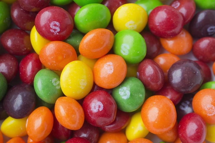 This Wednesday, June 1, 2016, photo shows Skittles, in New York. The Associated Press takes a look at how candy, cookie and soda makers are shaping nutrition science. Critics say industry-funded research is marketing masquerading as science, but the findings nevertheless become a part of the scientific literature. (AP Photo/Mark Lennihan)