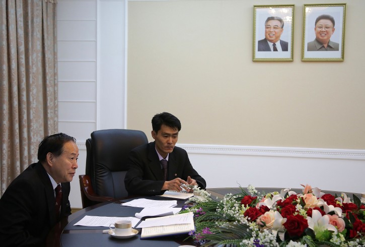 Han Song Ryol, director-general of the department of U.S. affairs at North Korea's Foreign Ministry, left, speaks during an interview with The Associated Press on Friday, June 24, 2016, in Pyongyang, North Korea. Han told The Associated Press on Friday that his country is now a nuclear threat to be reckoned with, and Washington can expect more nuclear tests and missile launches like the ones earlier this week as long as it attempts to force his government's collapse through a policy of pressure and punishment. (AP Photo/Wong Maye-E)