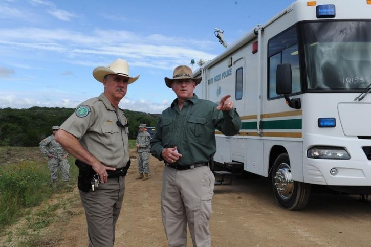 Texas Game Warden Jeff Gillenwaters and Chris Zimmer, deputy director for Fort Hood's Directorate of Emergency Services, discuss search and recovery efforts for four missing soldiers in Fort Hood, Texas, June 3, 2016. Reuters