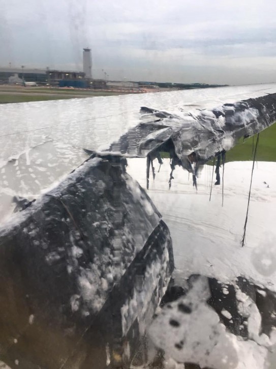 This image provided by Lee Bee Yee shows the aftermath of an engine fire on a Singapore Airlines flight, at Changi International Airport on Monday, June 27, 2016. A Singapore Airlines statement said the Boeing 777-300ER was on its way to Milan when it turned back 