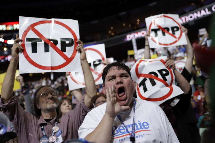 Supporter for former Democratic Presidential candidate, Sen. Bernie Sanders, I-Vt., John Stanley from DeForest Wis., yells as he and other Sanders supporters react during the first day of the Democratic National Convention in Philadelphia , Monday, July 25, 2016. (AP Photo/John Locher)