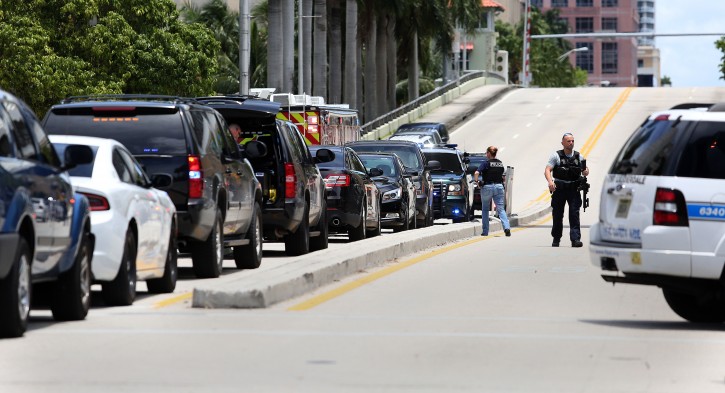Authorities search for Dayonte Resiles after he escaped from the Broward County Courthouse, Friday, July 15, 2016, in Fort Lauderdale, Fla. Resiles, who was awaiting trial for the slaying of a woman whose family founded the Halliburton oil services company, slipped out of his shackles and bolted from a courthouse Friday just before a hearing on whether he could face the death penalty. (Carline Jean/South Florida Sun-Sentinel via AP)