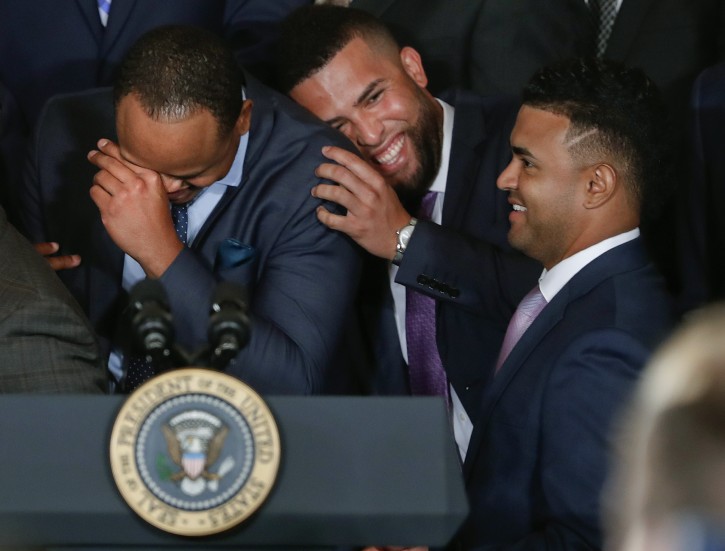 Kansas City Royals players from l-r., Edinson Volquez, Kelvin Herrera, and Christian Colon share a laugh as they wait for the arrival of President Barack Obama during a ceremony in the East Room of the White House in Washington, Thursday, July 21, 2016, where the president honored the 2015 World Series Champion baseball team. (AP Photo/Pablo Martinez Monsivais)