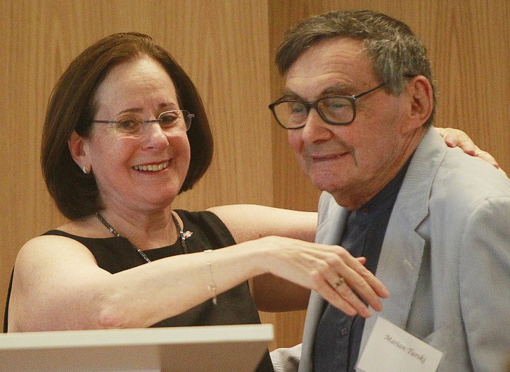 Stanlee Stahl, left, executive vice president of the Jewish Foundation for the Righteous, hugs Marian Turski, a Holocaust survivor, in Warsaw, Poland, on July 10, 2016. A group of Polish Christians who risked their lives to give aid to Jews during the Holocaust were brought together for a luncheon in Warsaw to be honored and celebrated by a U.S.-based Jewish organization that provides aid to these rescuers. (AP Photo/Czarek Sokolowski)