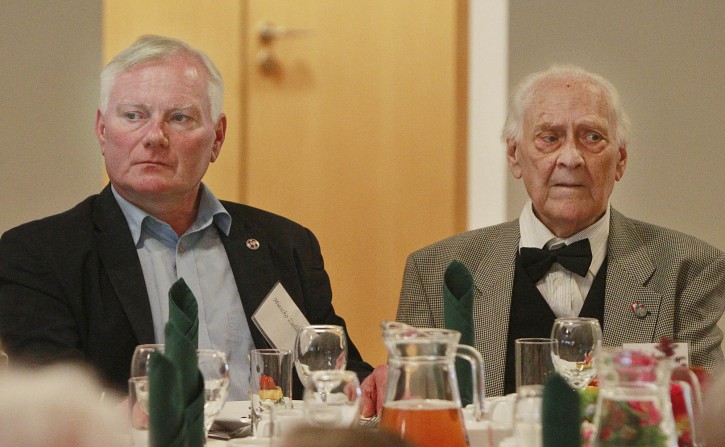 Ryszard Zielinski, 85, right, a Pole who helped to save Jews during World War II, attends a luncheon, accompanied by his son Mieszko, in Warsaw, Poland, on July 10, 2016. A group of Polish Christians who risked their lives to give aid to Jews during the Holocaust were brought together for a luncheon in Warsaw to be honored and celebrated by a U.S.-based Jewish organization that provides aid to these rescuers. (AP Photo/Czarek Sokolowski)