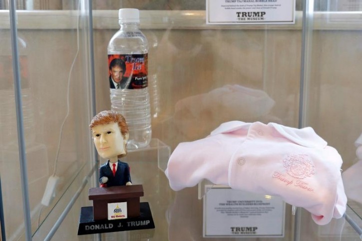 Trump Ice pure spring water, a Trump Tower onesie, and a Trump Taj Mahal bobble head are displayed at The Trump Museum near the Republican National Convention in Cleveland, Ohio, U.S., July 19, 2016.  REUTERS/Lucas Jackson 
