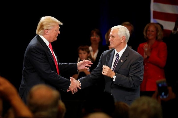 Republican presidential candidate Donald Trump (L) and vice presidential candidate Mike Pence attend a campaign event in Roanoke, Virginia, U.S., July 25, 2016.  REUTERS/Carlo Allegri