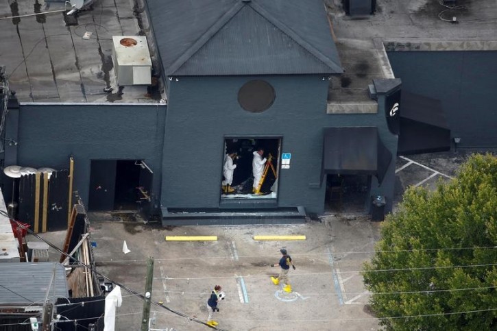 FILE - Federal Bureau of Investigation (FBI) officials collect evidence from the night club, the site of a mass shooting days earlier, in Orlando, Florida, U.S., June 15, 2016.  REUTERS/Adrees Latif   