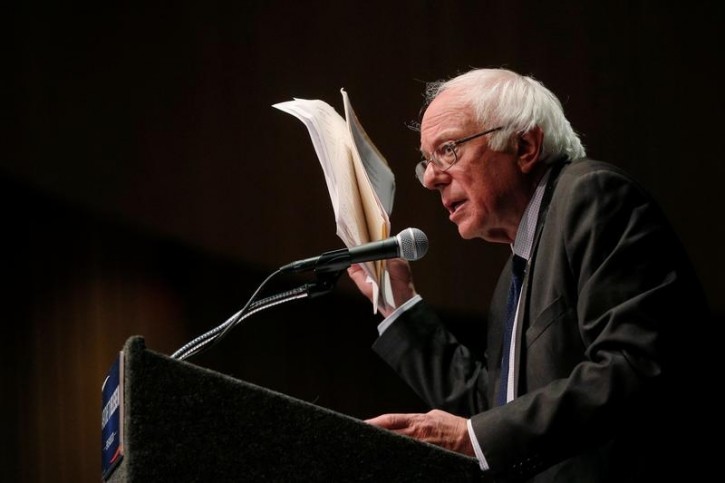 FILE - U.S. Democratic presidential candidate and U.S. Senator Bernie Sanders holds up his notes while speaking about his attempts to influence the Democratic party's platform during a speech in Albany, New York, U.S., June 24, 2016. REUTERS/Brian Snyder